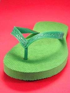 Green_flip_flops_on_red_background