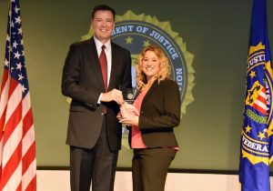 One of the recipients was Kellyann Kostyal-Larrier, the executive director of Safe Homes of Orange County.