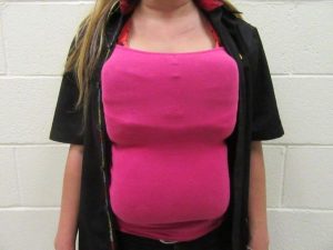 The 21-year-old woman tried to hide cocaine by taping it to her chest and stomach, via Border Patrol.